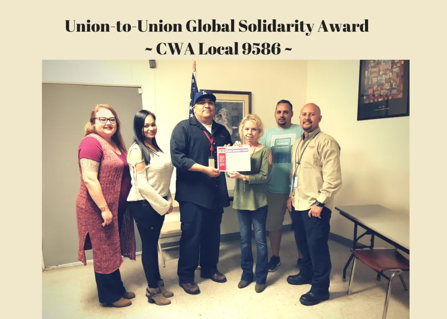 cwa_local_9586_executive_board_is_presented_with_the_districts_global_solidarity_award.jpg